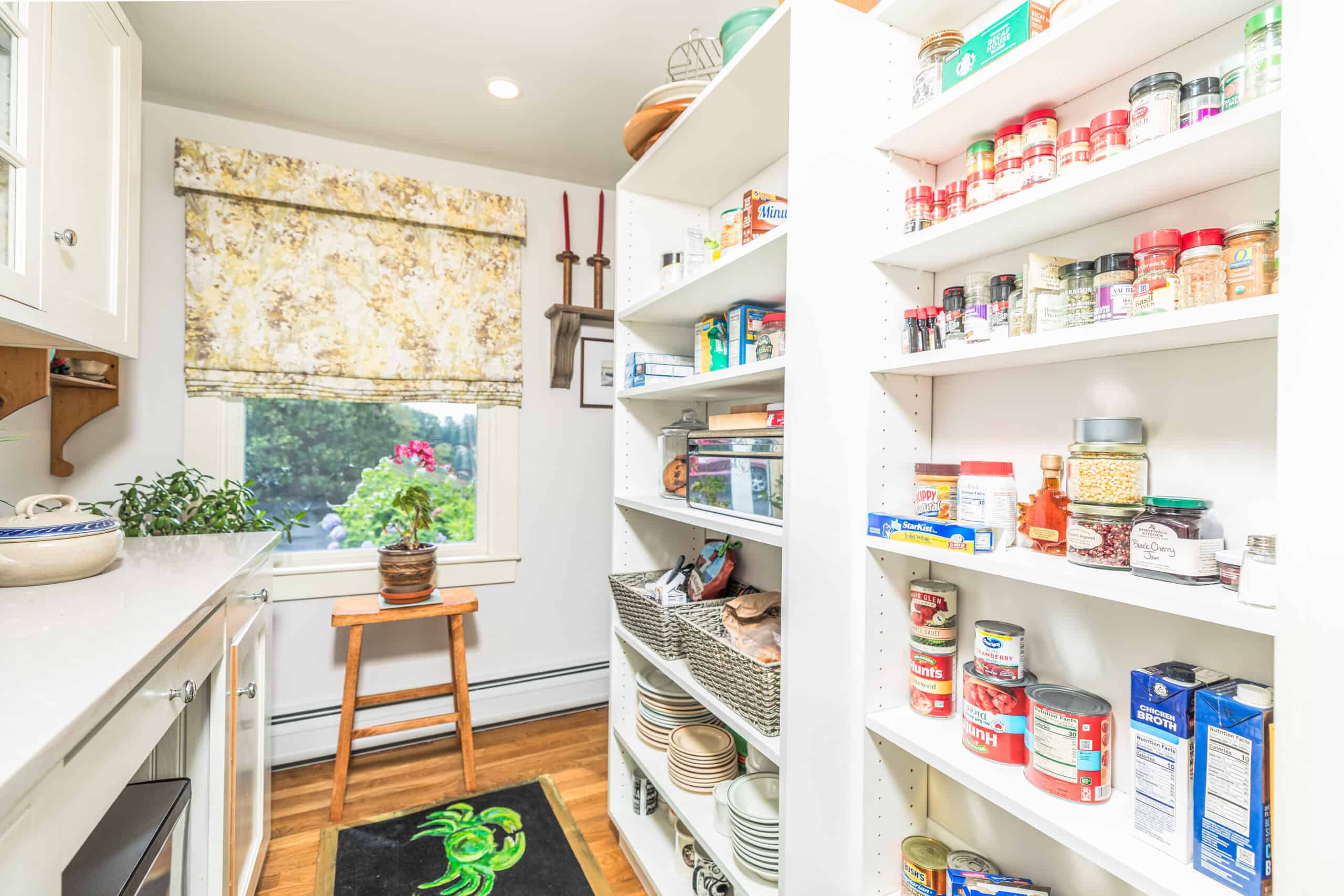 A large walk-in pantry with plenty of shelving storage incorporated into the design. 