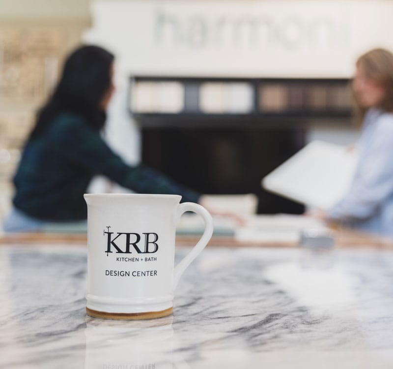 KRB custom coffee mug on a marble countertop in the KRB Design Center showroom